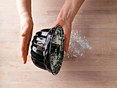 Test whether the baking tin is well greased - knock the flour out of the tin