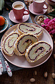 Cake roulade with pistachio cream and jam