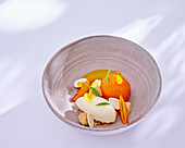 Apricot and orange compote with olive oil crumble and fermented milk cream