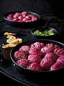 Hasselback radishes with pesto and bread crisps