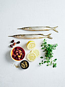 Ingredients for garfish with lemon, oregano and pickled onions