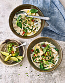 Asian noodle bowl with chicken and coconut milk