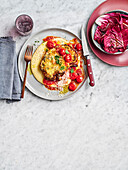 cauliflower schnitzel with cacio e pepe polenta and roast tomato sugo