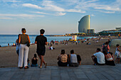 Barceloneta beach promenade with the W Hotel in the background, Barcelona, Spain