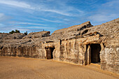 Visitors admire the impressive stands of Itálica amphitheater in Santiponce, showcasing its historical architecture and rich heritage.