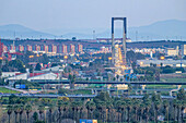Seville, Spain, Jan 26 2020, The Centenario Bridge stands tall against the evening sky, capturing traffic flow and city lights in Seville, Andalusia during twilight.