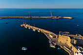 Aerial view of Porto Antico, the historic old port, the Marina, Castello Carlo V and the old town, Monopoli, Italy