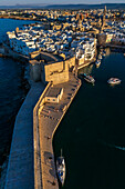 Aerial view of Porto Antico, the historic old port, the Marina, Castello Carlo V and the old town, Monopoli, Italy