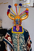 A mannequin wearing a Aya Huma or Diablo Huma costume in front of a shop in Mitad del Mundo, Ecuador.