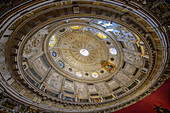 Admire the stunning coffered dome and marble floor of Sala Capitular, with Murillo's Immaculate Conception above ornate stalls.