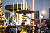 Seville, Spain, March 27 2018, A devotee admires the float of El Gran Poder, immersed in the solemnity of Holy Week celebrations in Seville, Andalusia, Spain.