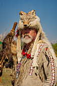 A mountain man in period dress with a coyote-skin hat at the Fort Bridger Mountain Man Rendezvous in Wyoming.
