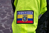 Ecuadorian flag shoulder patch on a policeman's uniform in Quito, Ecuador.