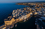 Aerial view of Porto Antico, the historic old port, the Marina, Castello Carlo V and the old town, Monopoli, Italy