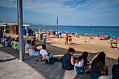People enjoying Barceloneta beach, Barcelona, Spain
