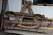 A vintage wooden yoike and cultivator at the Tahuantinsuyo Weaving Workshop, Otavalo, Ecuador.