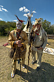 An Amerindian & a mountain man in period dress at the Fort Bridger Mountain Man Rendezvous in Wyoming.