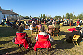 An outdoor Sunday church service in front of the Mormon Wall at the Fort Bridger Rendezvous in Wyoming.