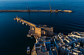 Aerial view of Porto Antico, the historic old port, the Marina, Castello Carlo V and the old town, Monopoli, Italy