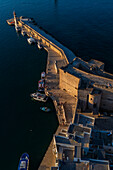 Aerial view of Porto Antico, the historic old port, the Marina, Castello Carlo V and the old town, Monopoli, Italy