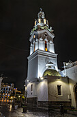 The bell tower of the Metropolitan Cathedral of Quito, Ecuador, on Calle Garcia Moreno at night.