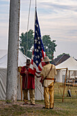 Men in period dress at the flag-raising ceremony at the Fort Bridger Rendezvous in Wyoming.