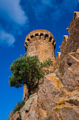 View of the fortification walls of the Iconic 12th-century castle, Tossa de Mar, Girona, Spain