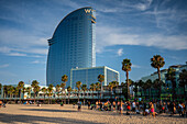 Barceloneta beach promenade with the W Hotel in the background, Barcelona, Spain