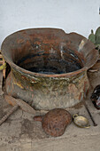 A vintage ceramic dye pot & stove at the Tahuantinsuyo Weaving Workshop, Otavalo, Ecuador.