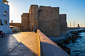 Sunset view of Castello Carlo V castle in Monopoli, Italy