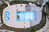 Aerial view of a luxurious villa with a beautiful swimming pool and scenic outdoor area, San Vito, Polignano a Mare, Bari, Italy.