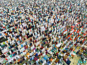 Aerial view of a crowded congregation celebrating Eid al-Fitr with devotion and faith, Sher-e-Bangla Nagar, Dhaka, Bangladesh.