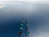 Aerial view of beautiful fish farms in marine water fishery with blue sea and coastal environment, Pentakomo, Limassol, Cyprus.