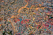 Aerial view of a sprawling settlement with tightly packed dwellings, a tapestry of textures and colors under the sun, Balukhali Bazar, Chittagong Division, Bangladesh.