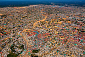 Aerial view of an expansive refugee camp sprawling across the landscape, with densely packed shelters and structures, Balukhali Bazar, Chittagong Division, Bangladesh.