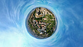 Aerial view of tiny planet perspective of historic architecture and beautiful buildings in Volterra, Pisa, Italy.