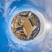 Aerial view of a tiny planet perspective of a beautiful city with buildings, a river, and a bridge under a cloudy sky, Hull, England, United Kingdom.