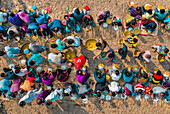 Bogura, Bangladesh - 25 February 2022: Aerial view of a colorful majlis public food offering with a large crowd celebrating together in a festive outdoor setting, Noongola, Rajshahi, Bogura, Bangladesh.