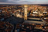 Aerial view of the medieval belfort bell tower and market square in the historic old town, Bruges, West Flanders, Belgium.