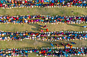 Aerial view of a vibrant community gathering during a public food offering, Saidpur, Shibganj, Rajshahi, Bangladesh.