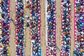 Aerial view of a vibrant majlis public food offering with colorful tables and plates, Sekherkola, Bogura, Rajshahi, Bangladesh.
