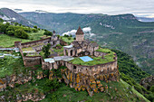 Aerial view of Tatev Monastery on the rocks, a monastery complex with view over the valley and mountains, Tatev, Syunik Province, Armenia.