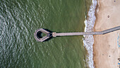 Aerial view of beautiful beach coastline with pier, Punta del Este, Uruguay.