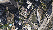 Aerial view of shadows stretching across the city's buildings and streets, revealing the urban landscape's textures and patterns from above, Los Angeles, California, United States.