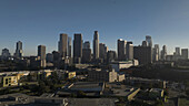 Los Angeles, United States - 25 June 2025: Aerial view of the skyline, a symphony of glass and steel piercing the morning haze, the city awakes under a vast, clear sky.
