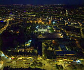 Aerial view of Edinburgh unfolds in a symphony of light and shadow, where ancient stone meets modern illumination, creating a mesmerizing tapestry of urban life under the cloak of night., Edinburgh, Scotland, United Kingdom.