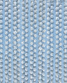 Aerial view of snow-laden trees stand in serene rows, a winter's embrace blanketing the landscape in a tranquil, icy blue hue, De Lutte, Overijssel, Netherlands.