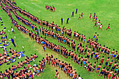 Bogura, Bangladesh - 07 March 2019: Aerial view of a vibrant green field filled with uniformed individuals, a stark contrast to the neatly arranged lines and scattered groups training.