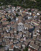 Aerial view of terracotta rooftops cascading around the grand church in the heart of the town, a tapestry of history and timeless beauty, Pacentro, Province of L'Aquila, Italy.