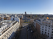 Aerial view of Puerta de Alcala surrounded by beautiful buildings and bustling street life, Salamanca, Madrid, Spain.